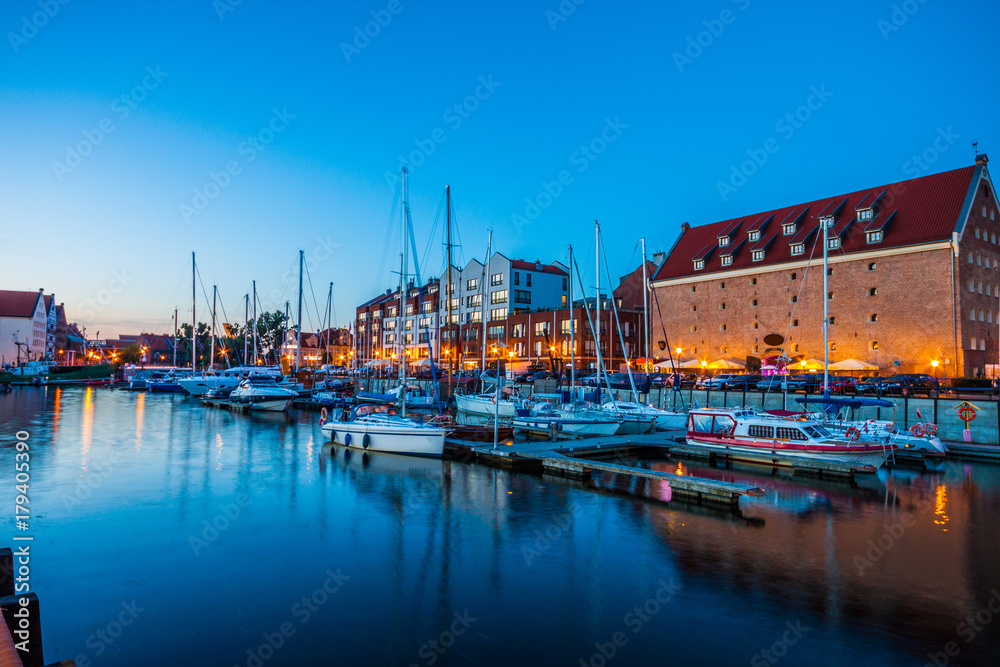 Moored yachts in harbor of Gdansk at night