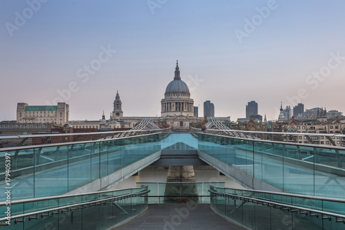 St Paul's Cathedral seen from Millenium Bridge in London, the UK at the sunrise