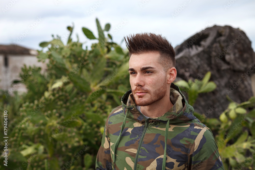 Attractive guy with military jacket