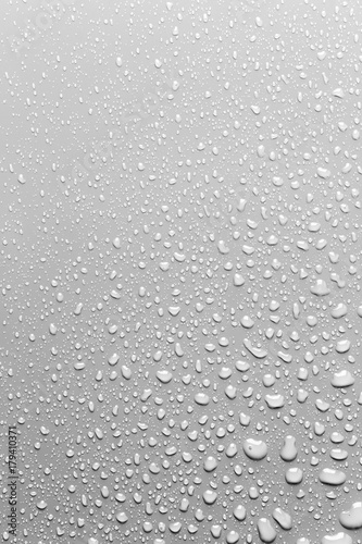 Surface with water drops, grey background
