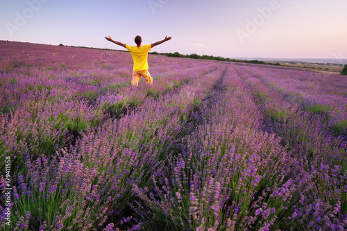 Fototapeta Naklejka Na Ścianę i Meble -  Man in meadow of lavender.