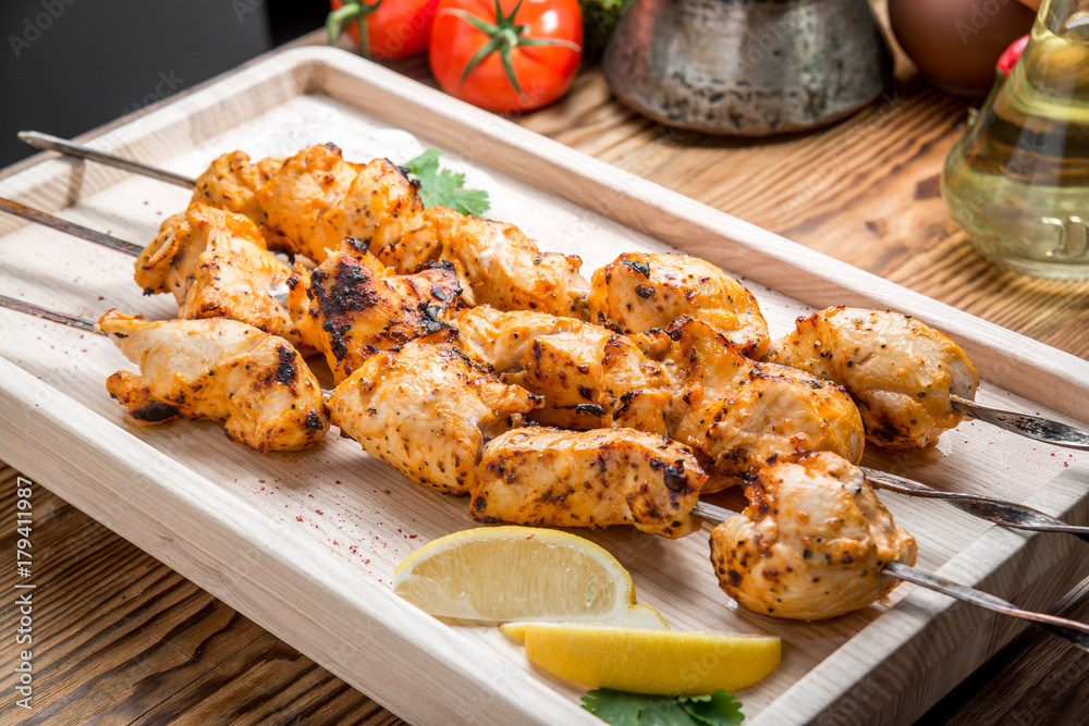 Assorted delicious grilled meat with vegetable on white plate picnic table for family bbq party Assorted delicious grilled meat with vegetable on white plate picnic table for family bbq party
