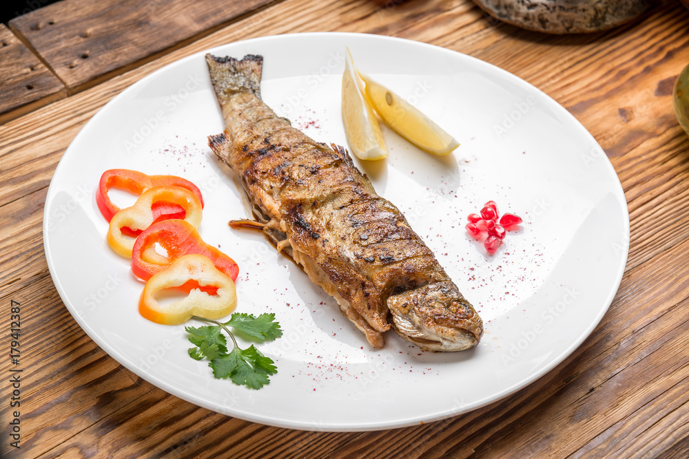 Fish dish - fried fillet with vegetables Fish dish - fried fillet with vegetables