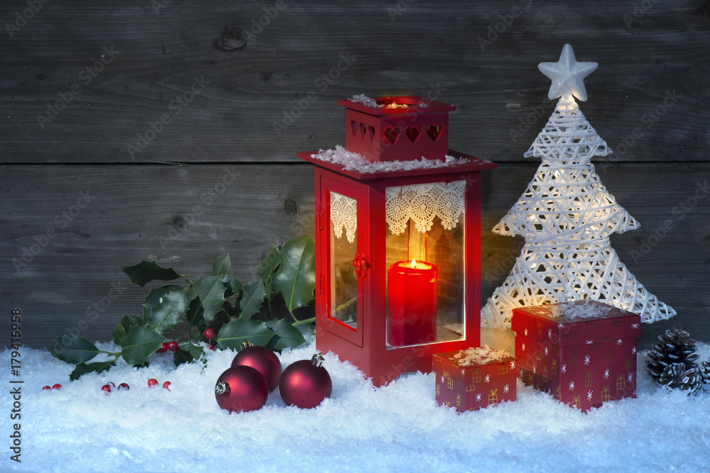 New Year's still-life postcard-red lamp candle wax-boxes gift-box Christmas tree light bulbs lights wooden background New Year's still-life postcard-red lamp candle wax-boxes gift-box Christmas tree light bulbs lights wooden background