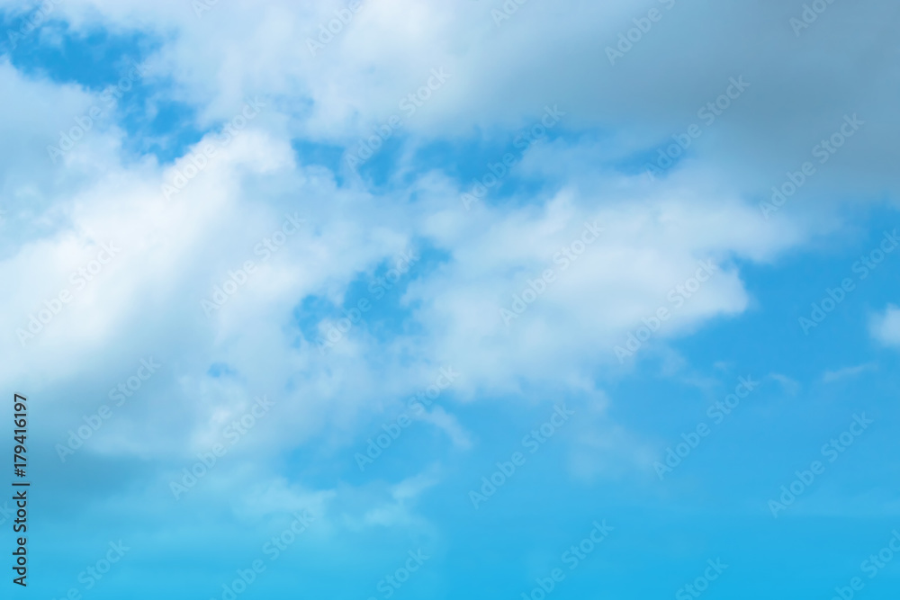 Naklejka premium The blue backdrop has some clouds.