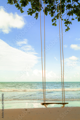 Swing hanging under the tree on beach © rueangrit