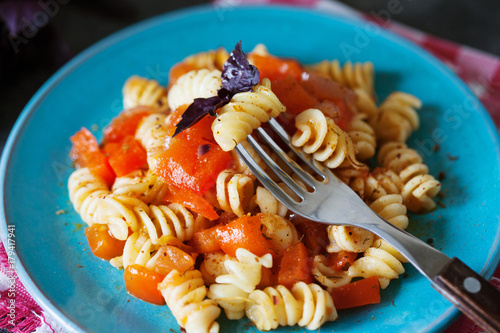 Vegetarian fusilli pasta with salsa sauce photo