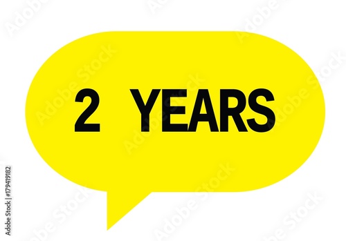 2 YEARS text in yellow simple speech bubble.