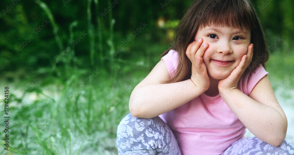 Portrait of beautiful little girl with down syndrome Portrait of beautiful little girl with down syndrome