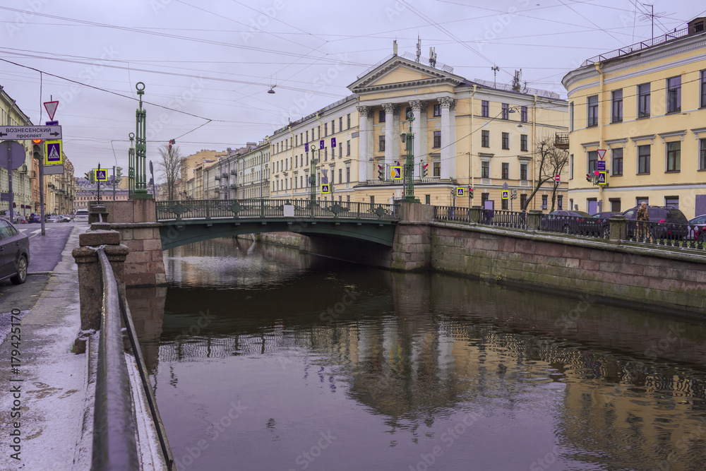 Ascension Bridge on the Griboedov Canal in St. Petersburg on a cold autumn day. The inscription on the index 