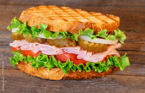 Sandwich with ham, lettuce and tomatoes
