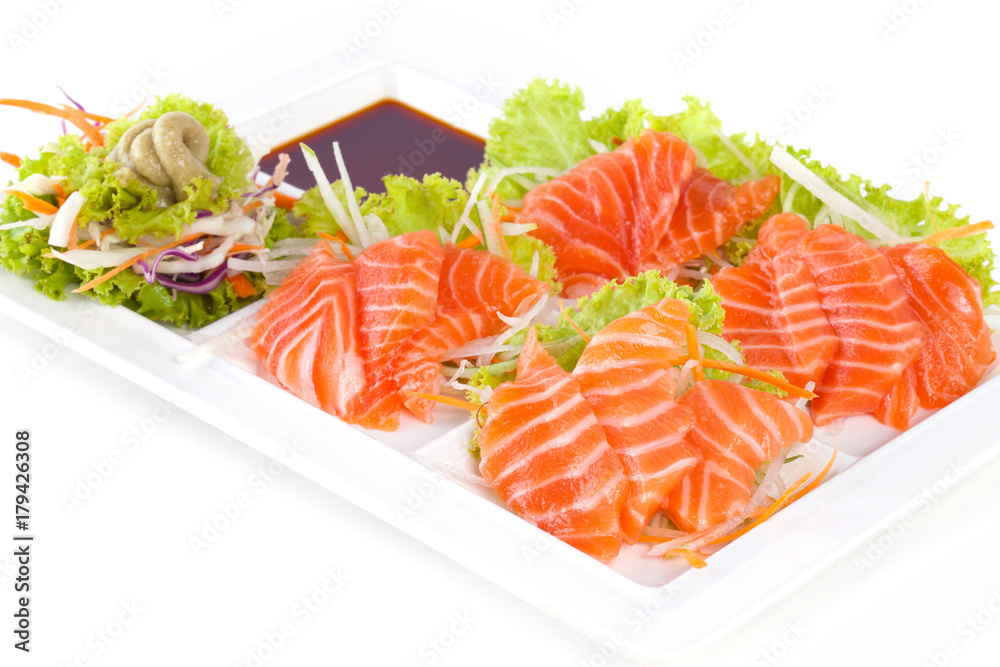 raw salmon with wasabi and sauce isolated on white plate on white background raw salmon with wasabi and sauce isolated on white plate on white background