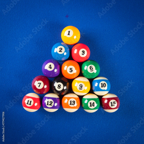 billiard balls in a blue pool table