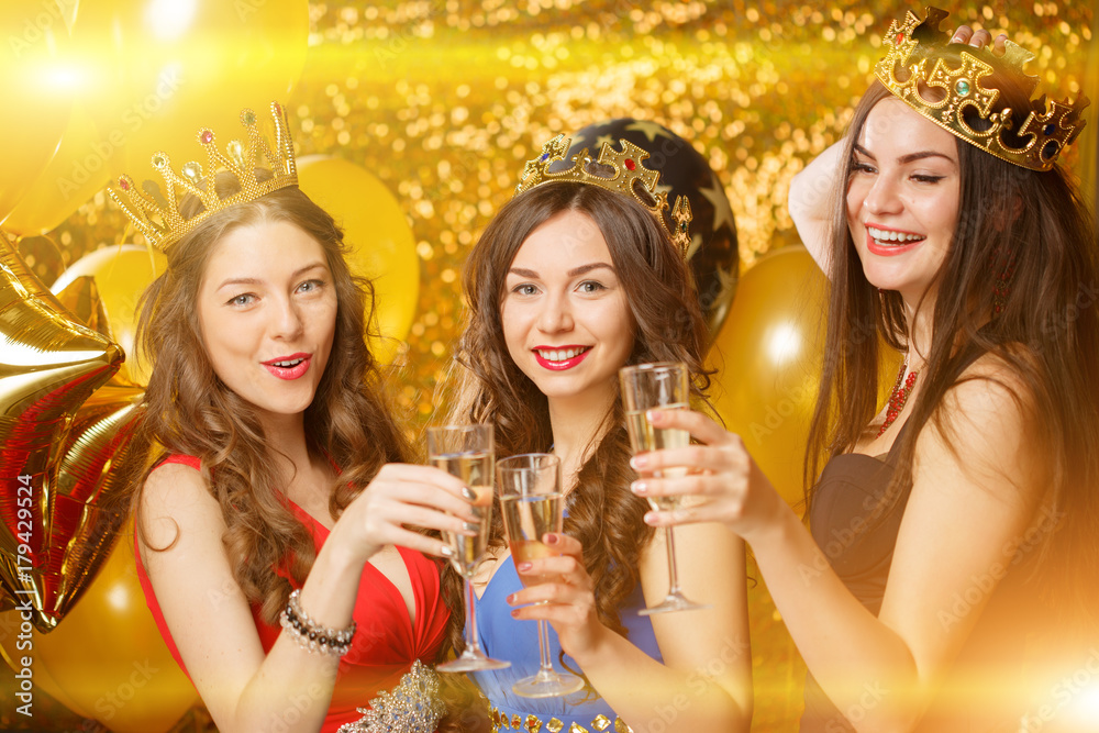 Party girls dancing in club. Women celebrate a holiday, a birthday or a new year. Party girls dancing in club. Women celebrate a holiday, a birthday or a new year.