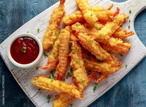 Fried Shrimps tempura with sweet chili sauce on white wooden board