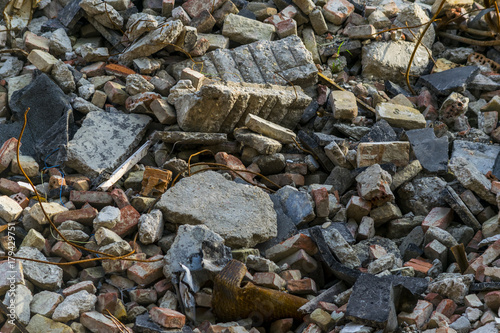Pile of rubbish, demolished house, background. Stone, brick and metal debris waste, closeup.