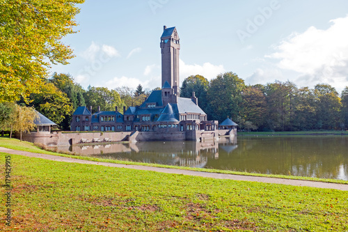 View of St. Hubertus Hunting Lodge in Dutch National Park De Hoge Veluwe in the Netherlands photo