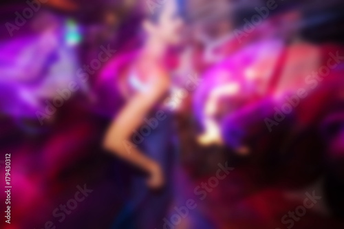 blurry background of men and women dance in nightclub © suwanphoto