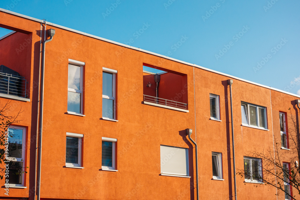 red facade of townhouses