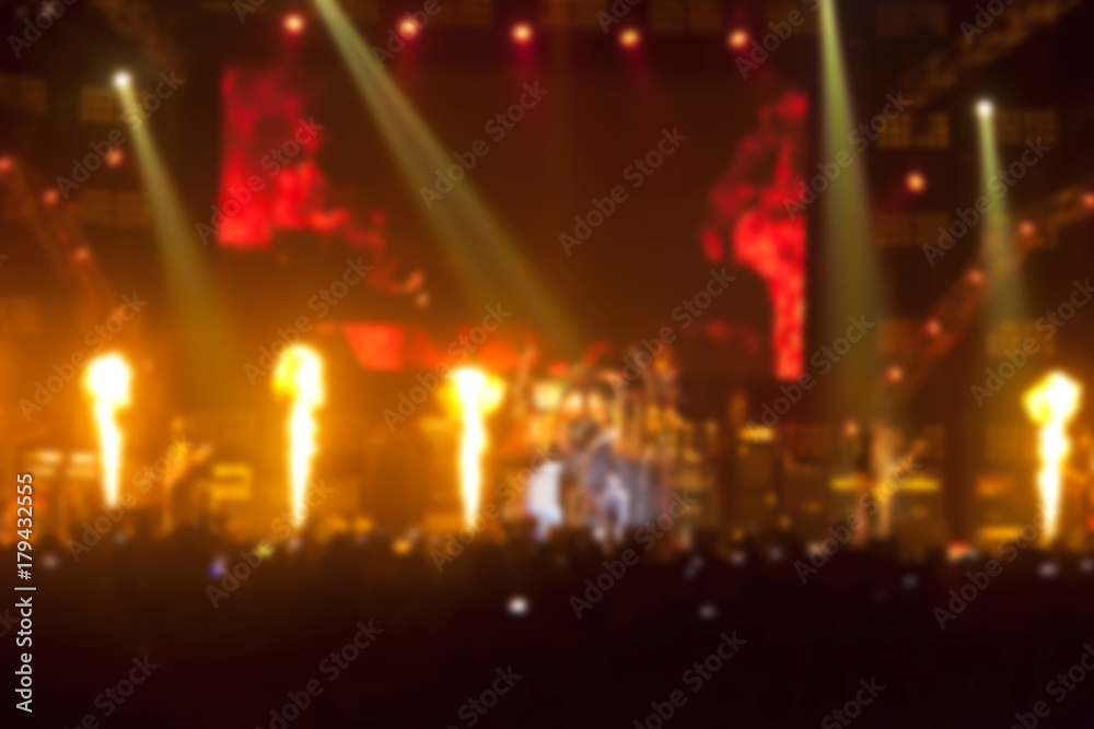 blurry image background of musicians rock in big rock concert.