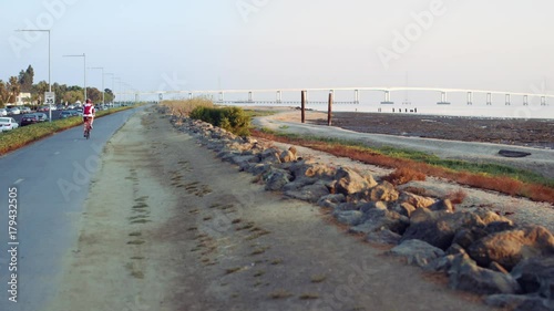 A bicyclist gets his exercise by going for an early morning ride in the San Francisco Bay area. photo