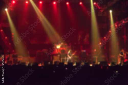 blurry image background of musicians rock in big rock concert.