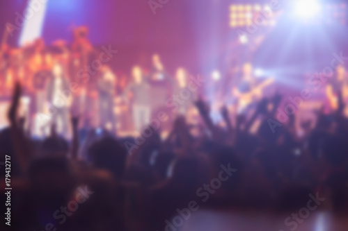 blurry image background of many audience concert in big rock concert. © suwanphoto