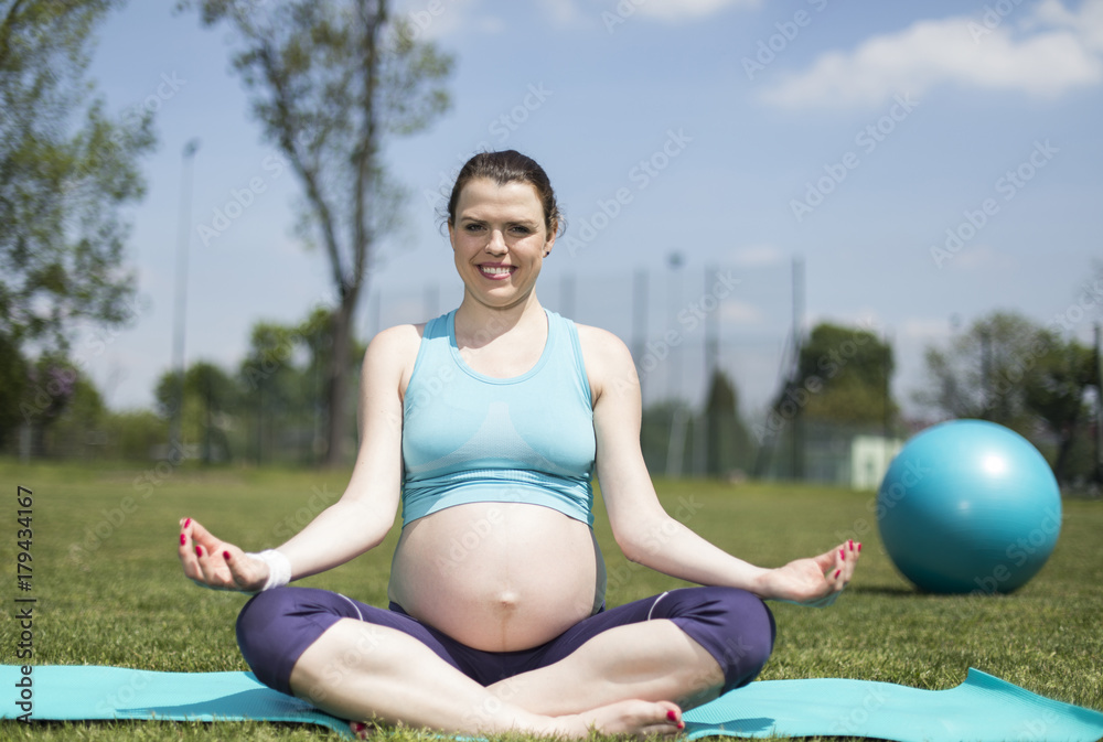 Pregnant woman excercises with gymnastic ball Pregnant woman excercises with gymnastic ball