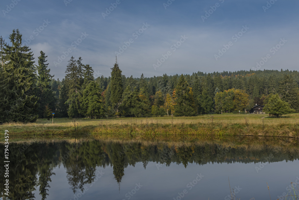 Small pond near Kladska village in fog wet cold morning