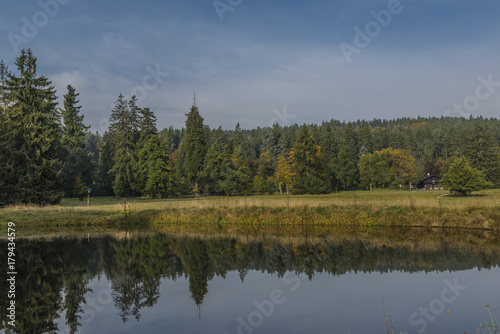 Small pond near Kladska village in fog wet cold morning