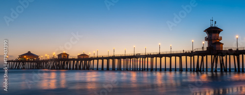 The Huntington Beach Pier in Huntington Beach at twilight sunset glow