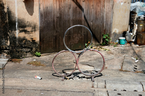 Round steel of wheel car is on the street at old town  photo