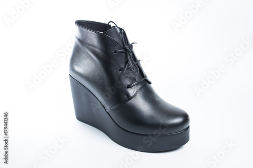 Female black boots isolated on a white background. © vfhnb12
