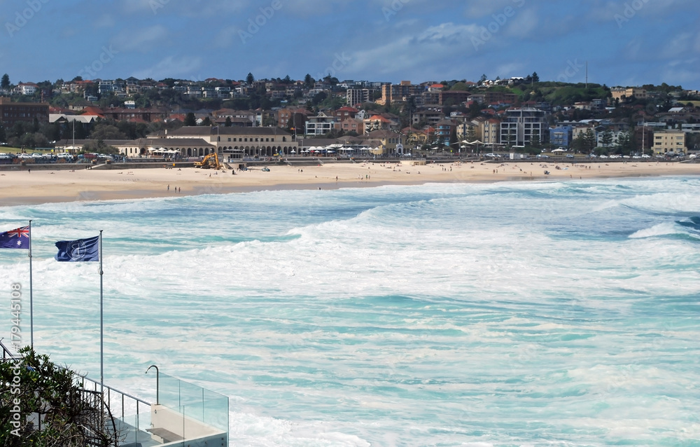 Blue flags and beach arc at Bondi Beach in Sydney, Australia