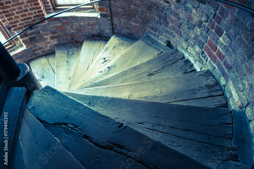 ancient wooden spiral staircase in a old tower