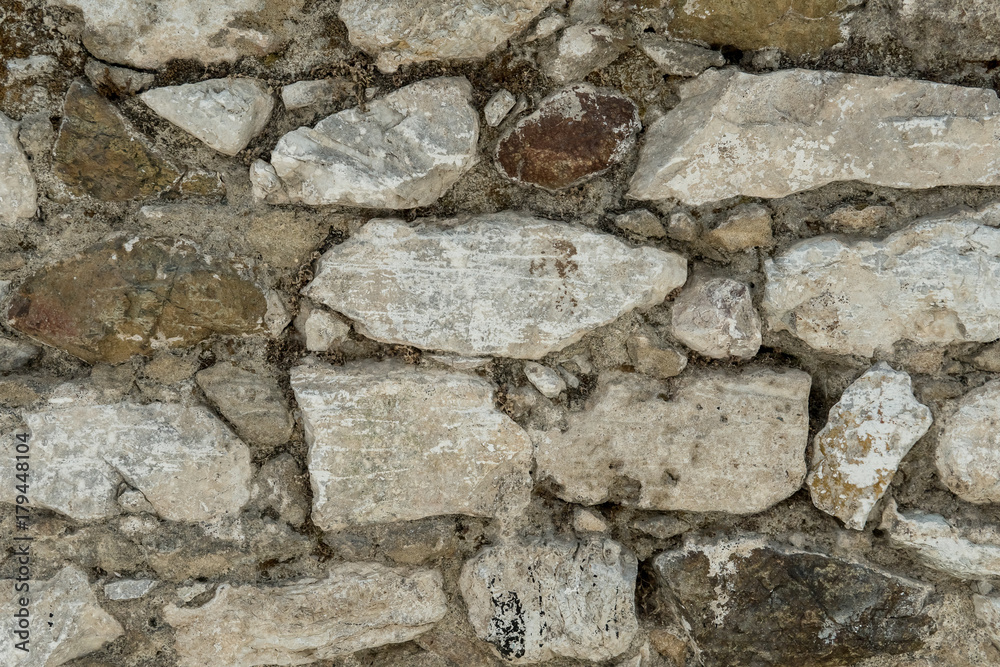 Granite texture, stone wall surface closeup Granite texture, stone wall surface closeup
