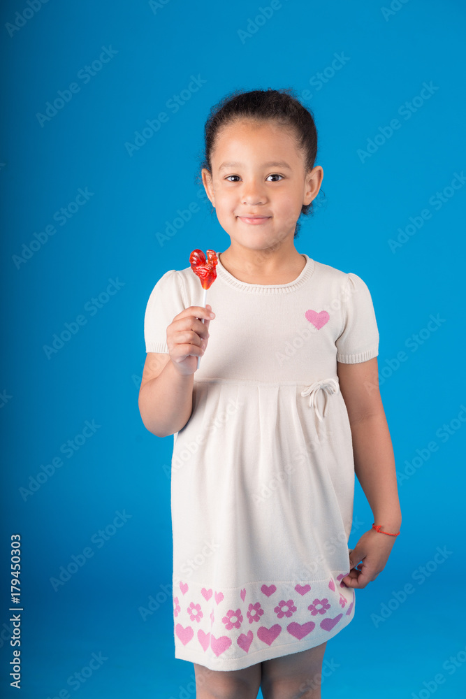 Cute young African girl with long curly hair smiling confidently Stock ...