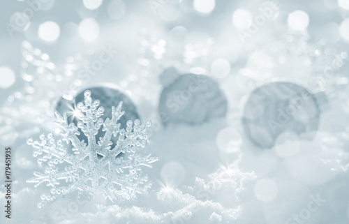 Christmas background with decorative snowflake and balls in the snow