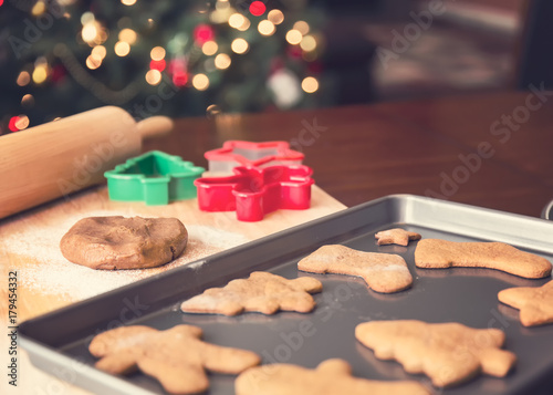 Baking tray with gingerbread holiday cookies