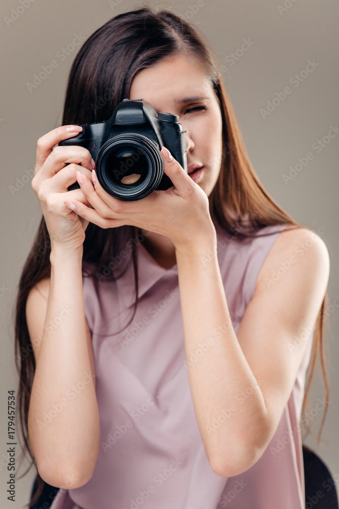 Woman photographer is taking images with dslr camera Woman photographer is taking images with dslr camera