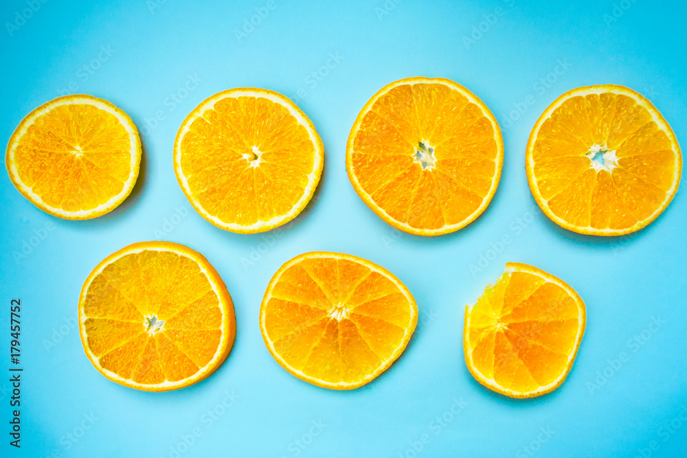 Circles of orange on a colorful blue background. Colorful background.