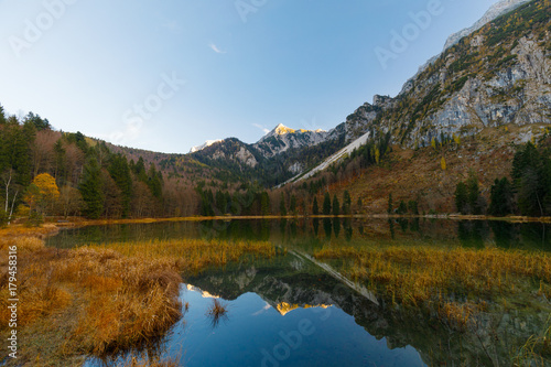 Reflection on Lake Frillensee, Inzell, Bavaria, Germany at sunset in fall with Mount Hochstaufen in Background © Jochen Netzker