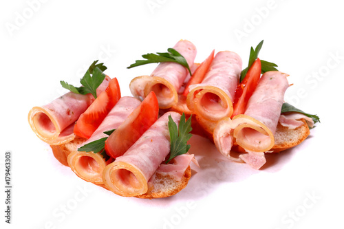 Sandwiches with rolled ham and tomatoes