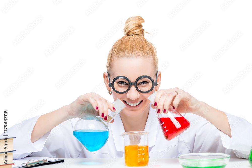 Happy lab assistant mixes fluids in a laboratory, girl in comic glasses Happy lab assistant mixes fluids in a laboratory, girl in comic glasses