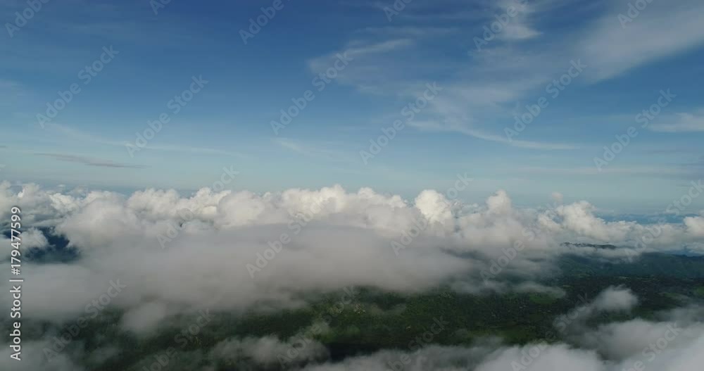 Aerial View. Flying over the beautiful mountain in clouds. Aerial View. Flying over the beautiful mountain in clouds.