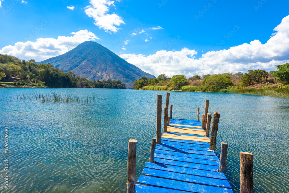 Beautiful bay of Lake Atitlan with view to Volcano San Pedro in highlands of Guatemala, Central America