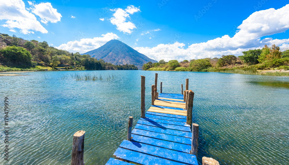 Beautiful bay of Lake Atitlan with view to Volcano San Pedro  in highlands of Guatemala, Central America
