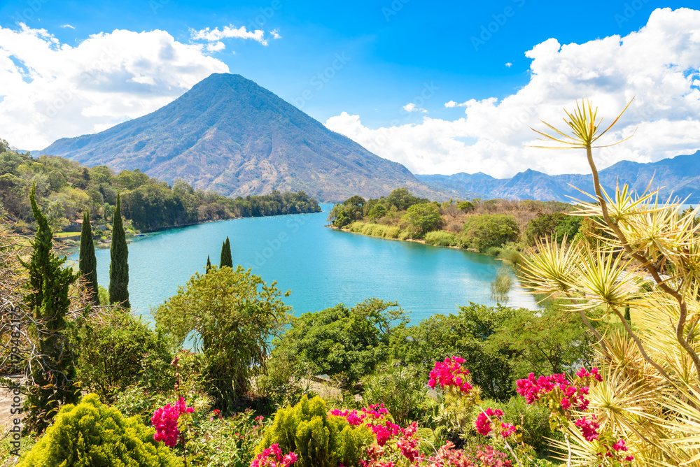 Naklejka premium Beautiful bay of Lake Atitlan with view to Volcano San Pedro in highlands of Guatemala, Central America