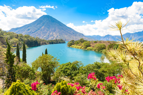 Beautiful bay of Lake Atitlan with view to Volcano San Pedro  in highlands of Guatemala, Central America photo