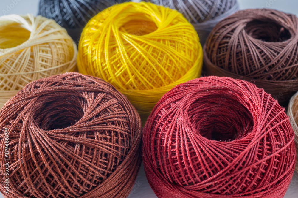 Piles of multi colored balls yarn background Piles of multi colored balls yarn background